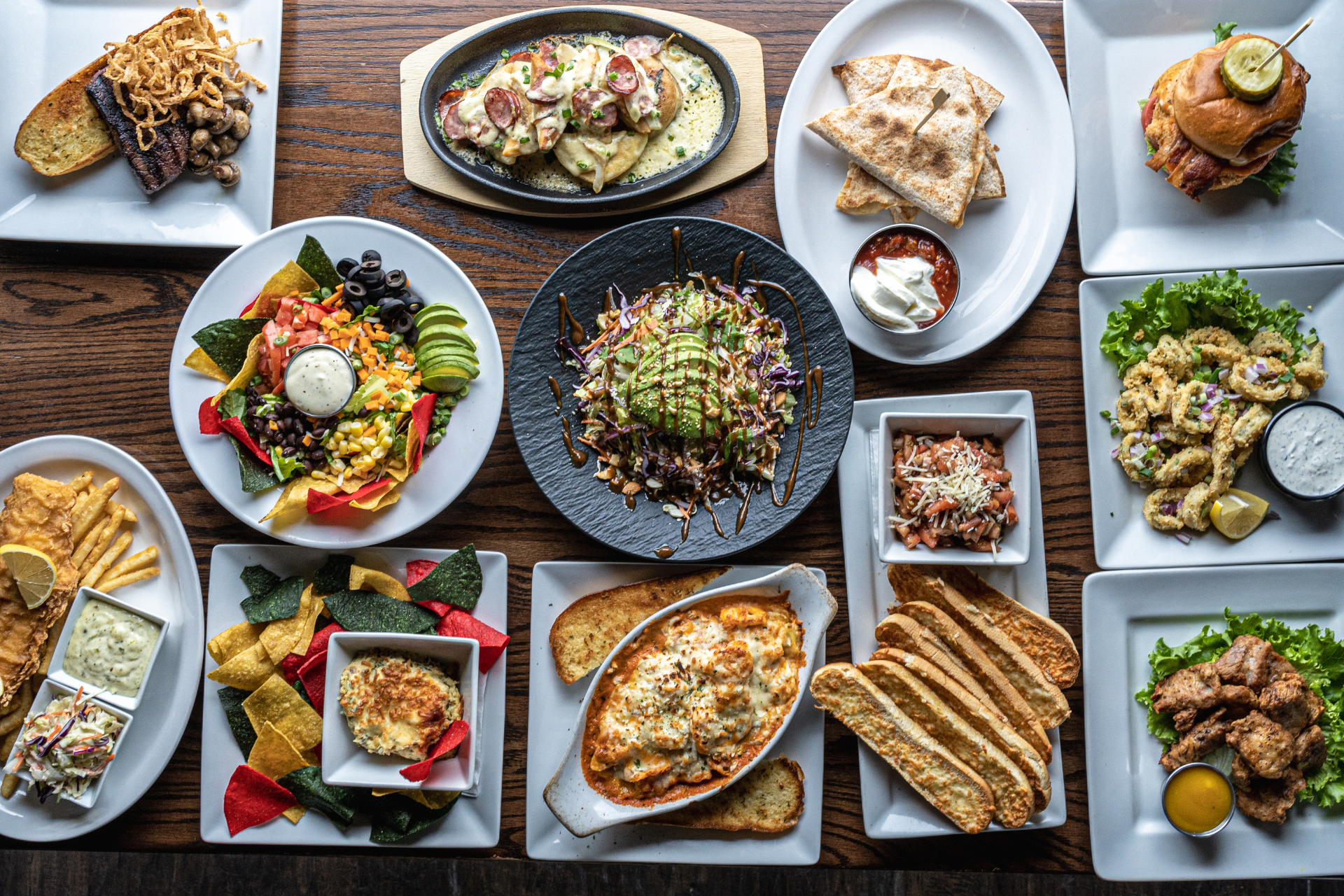 Table spread of shared dishes set out for a family meal